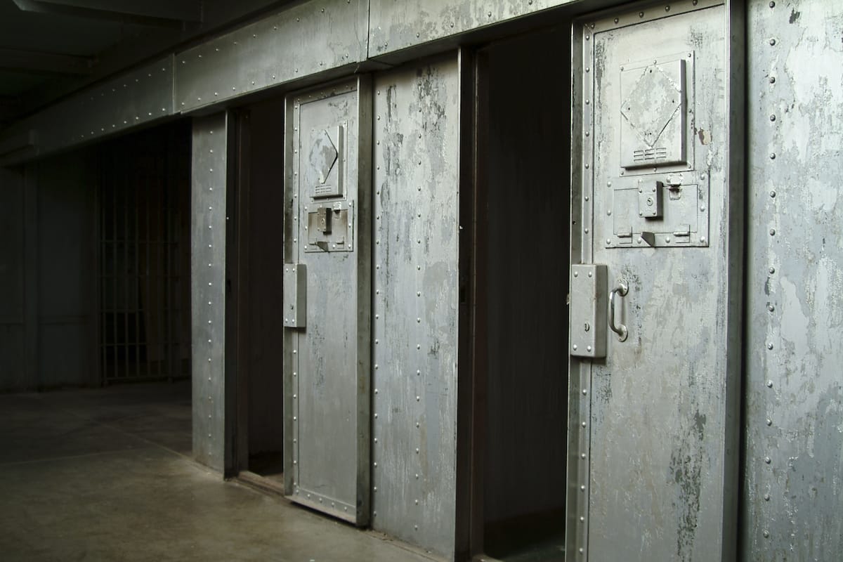https://ml38gwtypwbg.i.optimole.com/w:1200/h:800/q:mauto/f:best/https://impartial.one/wp-content/uploads/2024/07/solitary-confinement.png